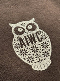 Decorative owl design with 'AIWC' text on a brown background